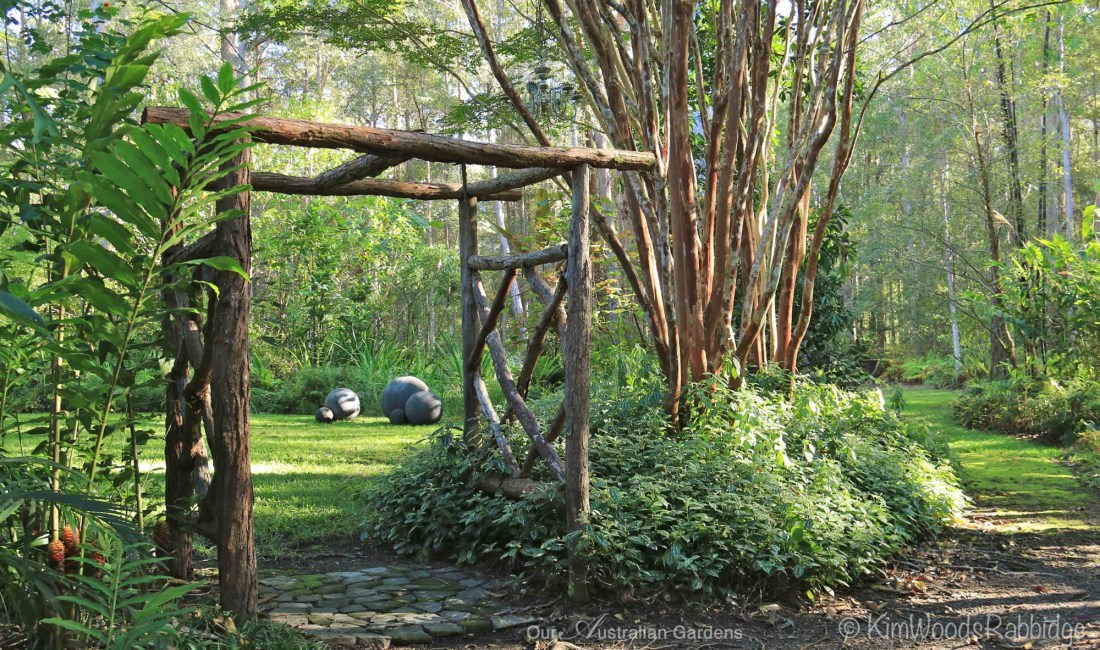 Natural timber arbours meld into the woodland setting.